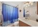Clean bathroom with a shower/tub combo and wood vanity at 38603 Taylor Rd, Myakka City, FL 34251