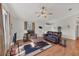 Living room featuring hardwood floors and a comfortable leather couch at 38603 Taylor Rd, Myakka City, FL 34251