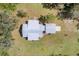 Aerial view of home showing metal roof and yard at 38603 Taylor Rd, Myakka City, FL 34251