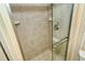 Large walk-in shower with neutral tile and glass door at 4416 Weybridge # 90, Sarasota, FL 34235