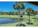 Enjoy peaceful water views and lush landscaping from this picturesque setting at 4416 Weybridge # 90, Sarasota, FL 34235
