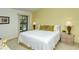 Spacious main bedroom with king-size bed and ample natural light at 4416 Weybridge # 90, Sarasota, FL 34235
