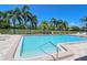 Community pool with surrounding patio and lounge chairs at 4416 Weybridge # 90, Sarasota, FL 34235