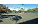 Tennis court with a covered seating area at 4416 Weybridge # 90, Sarasota, FL 34235