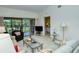 Living room with sofa, chairs, and access to bedroom at 4416 Weybridge # 90, Sarasota, FL 34235