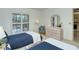 Two twin beds in a well-lit guest bedroom at 4416 Weybridge # 90, Sarasota, FL 34235