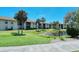 Community building with swimming pool and lush landscaping at 4416 Weybridge # 90, Sarasota, FL 34235