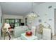Dining area with glass table and view of living room at 4416 Weybridge # 90, Sarasota, FL 34235