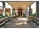 Covered walkway with benches leading to the community clubhouse at 4416 Weybridge # 90, Sarasota, FL 34235