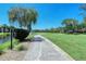 Scenic walking path alongside the golf course at 4416 Weybridge # 90, Sarasota, FL 34235
