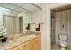Bathroom boasts granite countertops and updated shower at 4416 Weybridge # 90, Sarasota, FL 34235