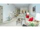 Bright living room with comfortable seating and view into dining area at 4416 Weybridge # 90, Sarasota, FL 34235
