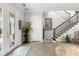 Elegant foyer with a grand staircase and ornate decor at 4561 Murcia Blvd # 13, Sarasota, FL 34238