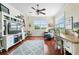 Bright office or den with built-in shelving, hardwood floors, and a tranquil view at 4561 Murcia Blvd # 13, Sarasota, FL 34238