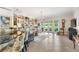 Bright living room with built-in shelving and views to the golf course at 4561 Murcia Blvd # 13, Sarasota, FL 34238