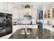 Modern kitchen featuring granite countertops and custom cabinetry at 4561 Murcia Blvd # 13, Sarasota, FL 34238