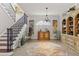 Spacious foyer with a staircase and built-in shelving at 4561 Murcia Blvd # 13, Sarasota, FL 34238