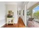 Bright hallway with hardwood floors and access to balcony at 4561 Murcia Blvd # 13, Sarasota, FL 34238