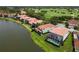 Aerial view showcasing a waterfront community with upscale homes and a golf course at 4561 Murcia Blvd # 13, Sarasota, FL 34238