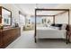 Spacious main bedroom with a large four-poster bed, sitting area, and ample closet space at 4561 Murcia Blvd # 13, Sarasota, FL 34238