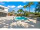 Inviting pool with patio, offering serene canal views at 4915 Primrose Path, Sarasota, FL 34242