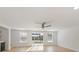 Living room with sliding doors opening to a view of the pool at 5321 13Th Avenue W Dr, Bradenton, FL 34209