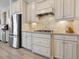 Clean kitchen featuring stainless steel appliances and white cabinets at 5553 Mulligan Way, Bradenton, FL 34211