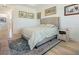 Spacious bedroom with large bed, nightstand and decorative rug at 5553 Mulligan Way, Bradenton, FL 34211