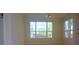 Bright dining area with large windows and neutral carpeting at 5701 Soldier Cir # 104, Sarasota, FL 34233