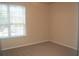 Bright bedroom with window and neutral decor at 5701 Soldier Cir # 104, Sarasota, FL 34233