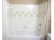 Bathroom with bathtub and tile surround at 5701 Soldier Cir # 104, Sarasota, FL 34233