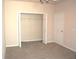 Spacious bedroom with walk-in closet and carpet at 5701 Soldier Cir # 104, Sarasota, FL 34233
