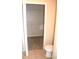 Small bathroom with toilet and wire shelving at 5701 Soldier Cir # 104, Sarasota, FL 34233