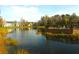 Tranquil lake view of community with homes at 5701 Soldier Cir # 104, Sarasota, FL 34233