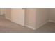 carpeted bedroom with white door at 5701 Soldier Cir # 104, Sarasota, FL 34233