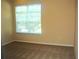 Well-lit bedroom with a large window and neutral carpet at 5701 Soldier Cir # 104, Sarasota, FL 34233