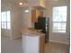 Kitchen with black appliances and a breakfast bar at 5701 Soldier Cir # 104, Sarasota, FL 34233