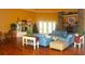 Community room with hardwood floors, comfortable seating, and a fireplace at 5701 Soldier Cir # 104, Sarasota, FL 34233