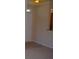 Simple entryway with light walls and carpeting at 5701 Soldier Cir # 104, Sarasota, FL 34233