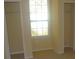 Bright bedroom featuring two closets and a large window at 5701 Soldier Cir # 104, Sarasota, FL 34233