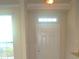 Front entry with a transom window above the door at 5701 Soldier Cir # 104, Sarasota, FL 34233