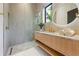 Modern bathroom featuring a glass-enclosed shower and bright vanity with modern fixtures at 5861 Gulf Of Mexico Dr, Longboat Key, FL 34228