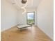 Bright bedroom featuring modern lighting and window with scenic views at 5861 Gulf Of Mexico Dr, Longboat Key, FL 34228