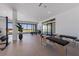 A large bonus room with massage tables and a gym setup with ocean views at 5861 Gulf Of Mexico Dr, Longboat Key, FL 34228