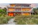 Expansive modern home with floor-to-ceiling windows offering breathtaking views of the beach at 5861 Gulf Of Mexico Dr, Longboat Key, FL 34228