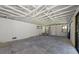Unfinished garage space showcasing a bright interior, concrete floors, and ample room for storage or projects at 5861 Gulf Of Mexico Dr, Longboat Key, FL 34228