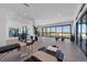 Bright, airy gym with massage tables, weights, and sliding glass doors offering ocean views at 5861 Gulf Of Mexico Dr, Longboat Key, FL 34228