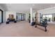 Spacious gym with weightlifting equipment, mirrored wall, and large windows that let in plenty of natural light at 5861 Gulf Of Mexico Dr, Longboat Key, FL 34228