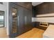 Gourmet kitchen featuring custom cabinetry, a wine fridge, and modern appliances at 5861 Gulf Of Mexico Dr, Longboat Key, FL 34228