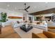 Cozy living room with large sofa, wood accents, and modern design at 5861 Gulf Of Mexico Dr, Longboat Key, FL 34228